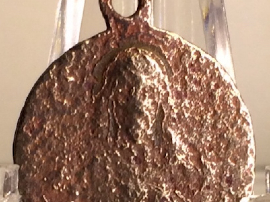A silver Sanctify pendant - front