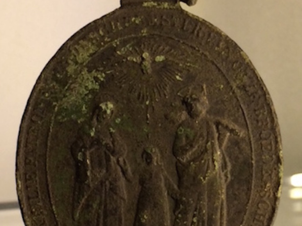 A beautiful medal sacres hearts of Jesus, Mary and Joseph - front