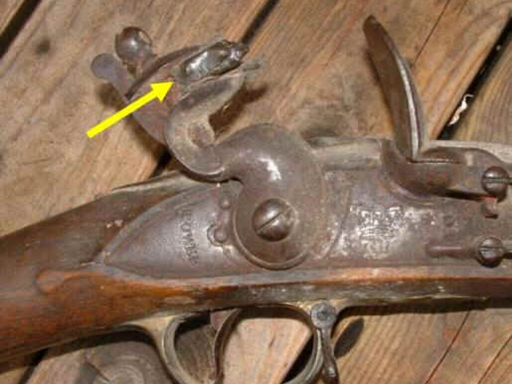 The flint lead holder with flint in the pistol